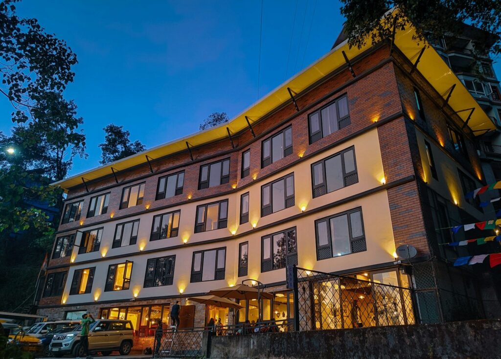 a large building with many windows lit up at night